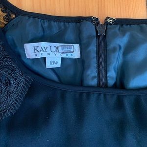 Kay Unger black party dress with lace sleeves.